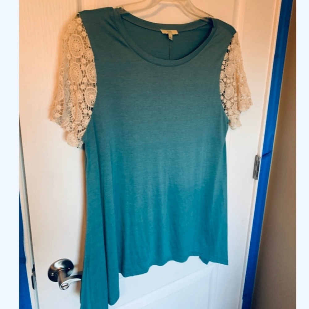 Kori Blue Shark Bite Style Top w/Cream Chrochet Sleeves
